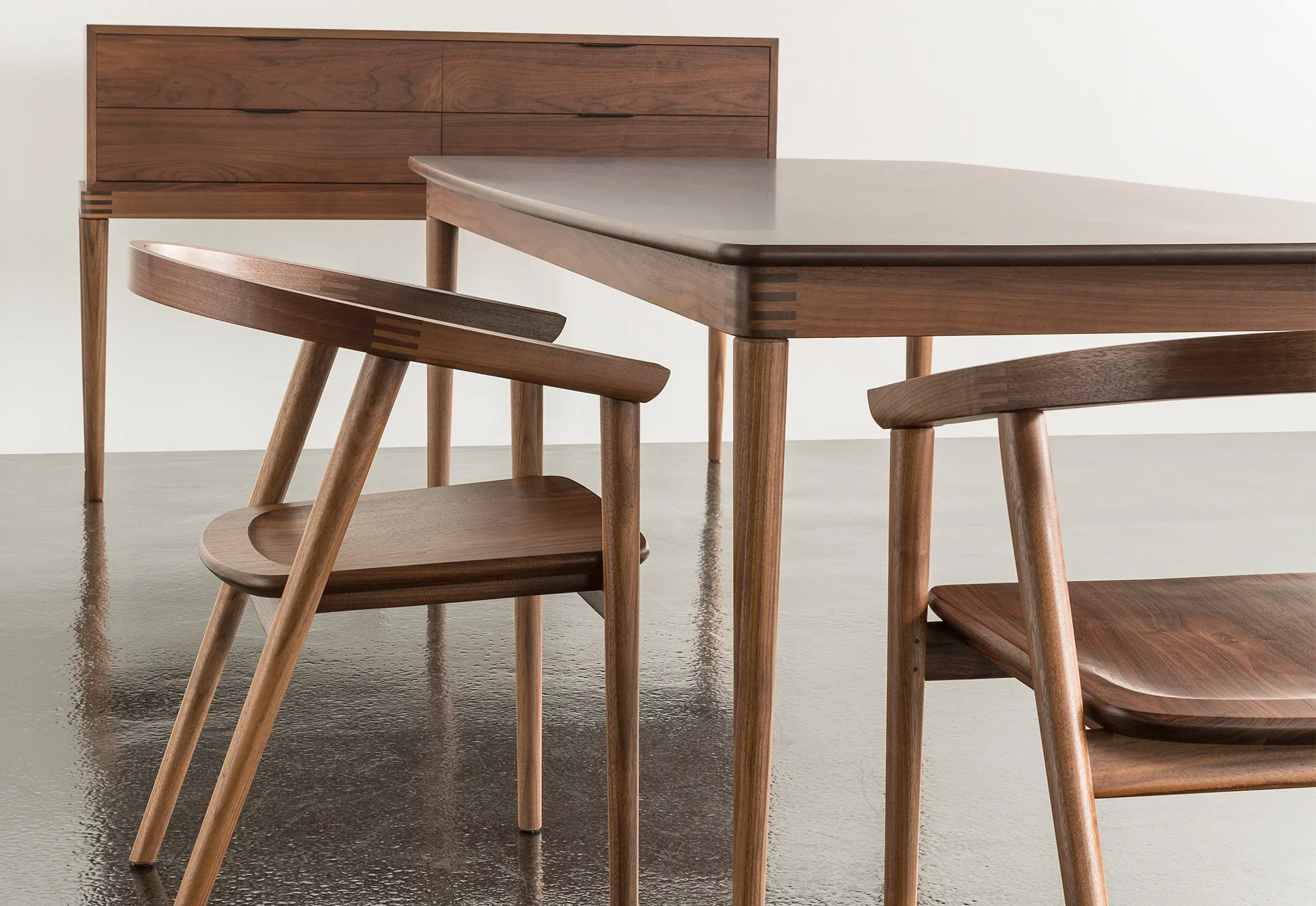 Table - Embracing the simplicity of functional forms, the dining table combines both open space and straight lines to